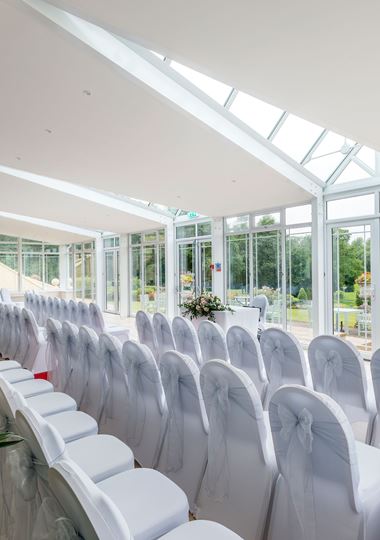 Conservatory wedding set up with view of golf course