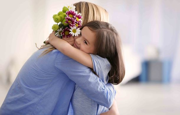 Girl hugging mother 